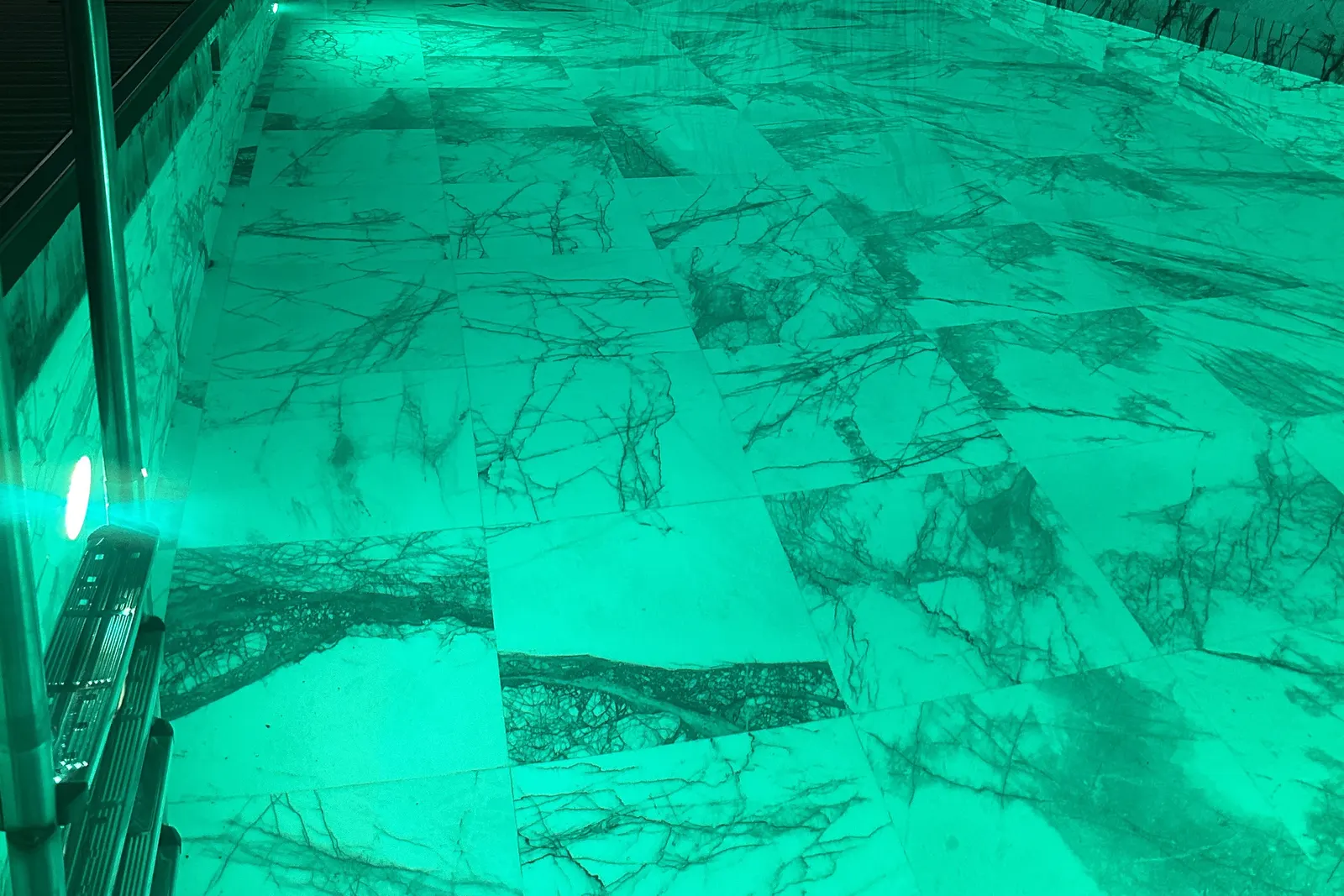 Indoor pool with green lighting at Wanda Vista